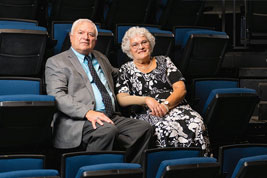 Photo of a couple sitting in an auditorium. Link to Life Stage Gift Planner Over Age 70 Situations.