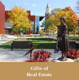 A statue of a woman on campus. Gifts of Real Estate